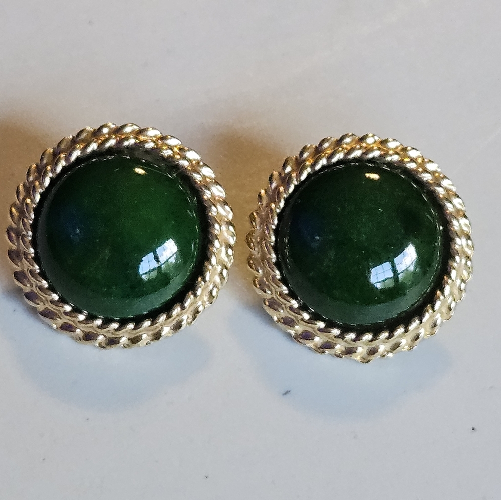Gold tone circular stud earrings with green stone
